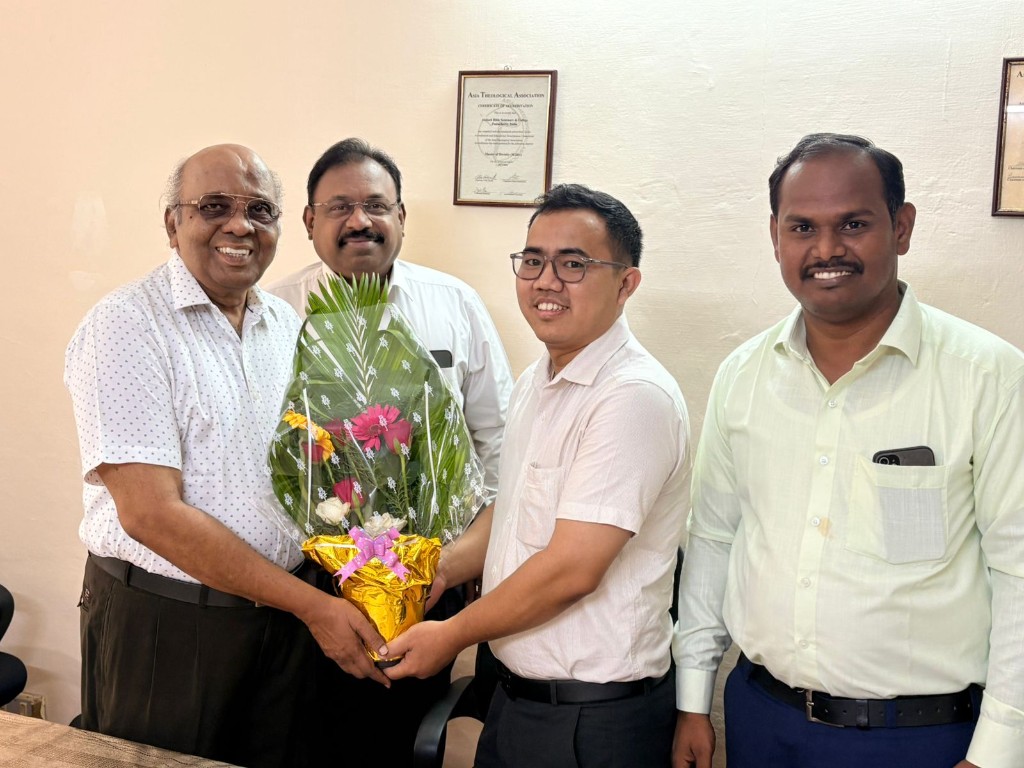 Alumni Spotlight - Bouquet presentation with faculty