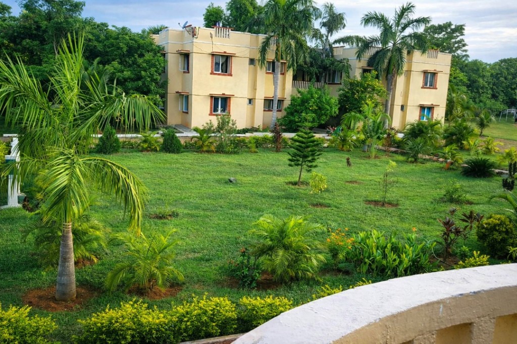 Campus Facilities - Residential block with landscaped lawn