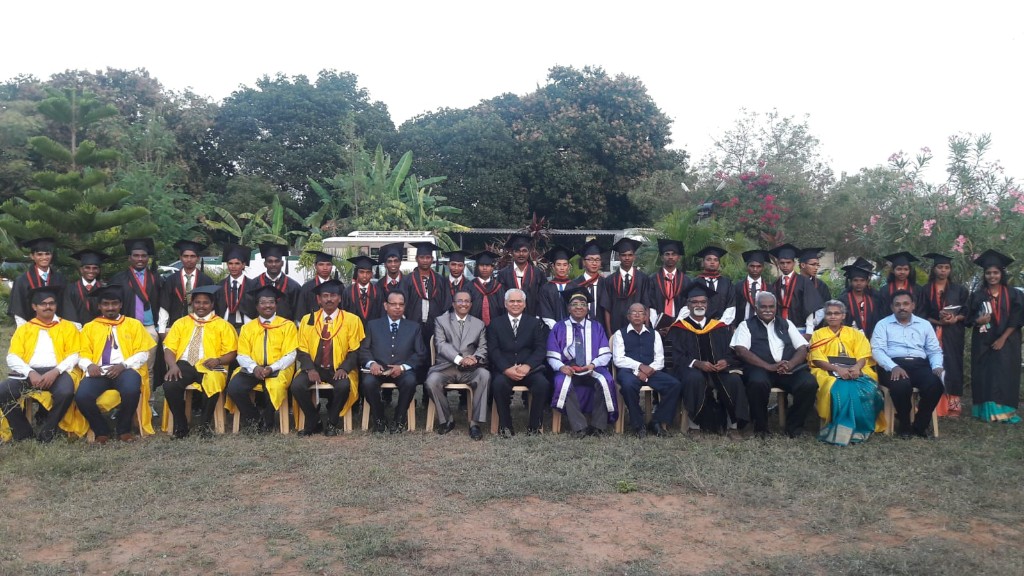 Graduation - Faculty and graduates group photo outdoors