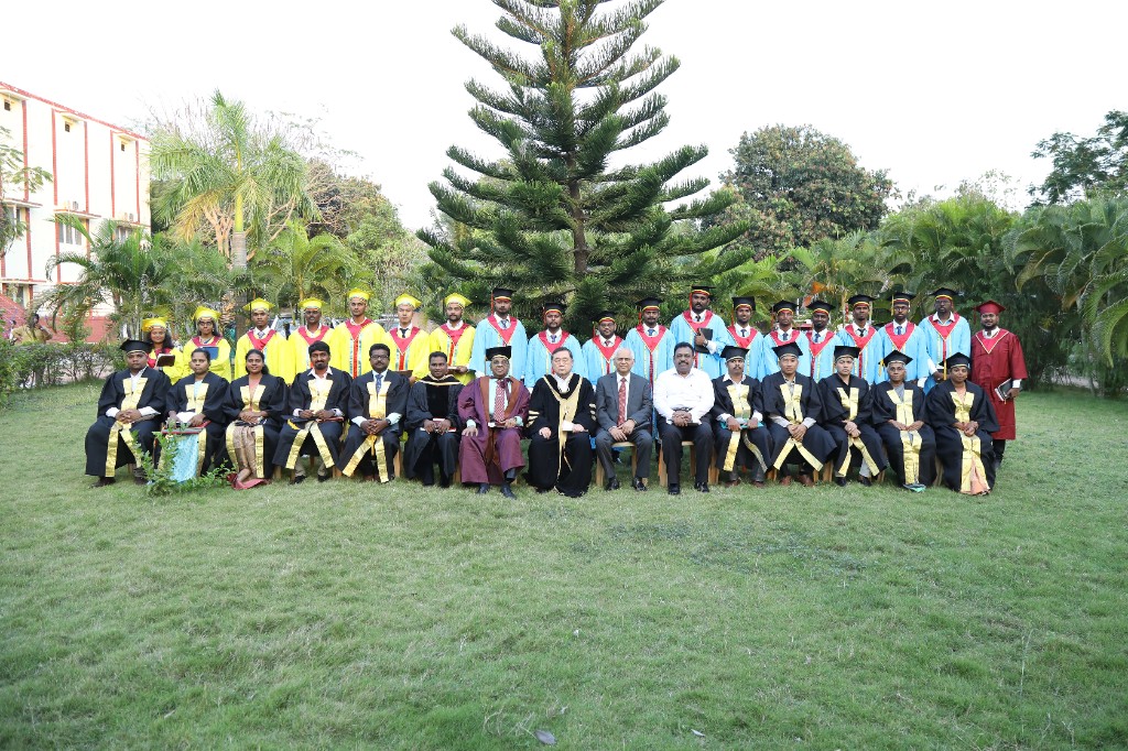 Graduation - Faculty and graduates formal group portrait